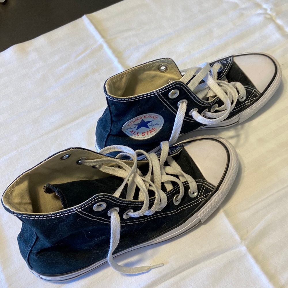 Black high top Converse.